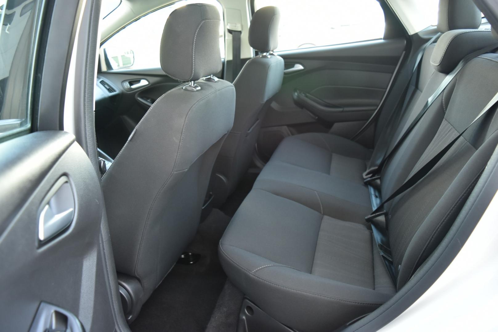 2018 White /Black Ford Focus SE (1FADP3F22JL) with an 2.0L I-4 GDI TI-VCT engine, 6-Speed Powershift Automatic transmission, located at 1600 E Hwy 44, Rapid City, SD, 57703, (605) 716-7878, 44.070232, -103.171410 - Photo#11